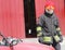 Italian fireman with protective uniform and red helmet
