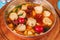 Italian fish soup with tomatoes, dough, dumplings, potatoes and greens. Mediterranean cuisine, European dish