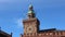 Italian flag and European flag fly on the Bologna clock tower