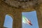 The Italian flag flutters next to the war memorial, historic center of Poppi, Arezzo, Italy