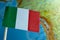 Italian flag with a globe map as a background