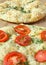 Italian focaccia (pizza) with tomatoes and herbs