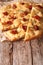 Italian focaccia with sun-dried tomatoes and rosemary close up.