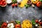 Italian food background. Pasta, herbs, vegetables on black top v