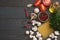 Italian food background, with tomatoes, parsley, spaghetti, mushrooms, oil, lemon, peppercorns on dark wooden table. Top view