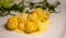 Italian food, fresh home made pumpkin stuffed pasta tortellini or ravioli dumplings with parmesan parmigiano reggiano cheese sauce