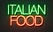 Italian food neon sign on brick wall background.