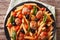 Italian Food: Pasta with meatballs, olives and tomato sauce closeup. Horizontal top view