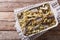 Italian food: pasta with sardines, fennel, raisins and pine nuts