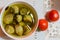 Italian food, pickled drilled artichokes hearts in olive oil