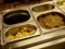 Italian food - Potatoes and eggplants in metal containers ready to be cooked