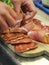 Italian food - Preparation of appetizer of Italian cold cuts, salami ham