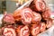 Italian food products rolled bacon in delicatessen seller