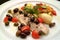 Italian food recipes, Ligurian branzino sea bass slice with olives, capers, tomatoes