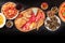 Italian food, shot from above on a black background