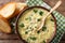 Italian food: soup stracciatella with farfalline and cheese close-up. horizontal top view