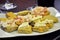 Italian food. Traditional Piemonte aperitivo: focaccia with fresh cheese and bacon