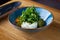 Italian fresh cheese Burrata with colorful cherry tomato salad, arugula and basil with pesto sauce