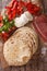Italian freshly baked piadina with ingredients close-up. vertica