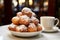 Italian fritters piled high, dusted with sugar powder on a cafeteria table. Traditional carnival sweets. Stack of Italian fritters