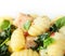 Italian gnocchi with basil and salmon closeup