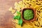 Italian green pesto sauce and collection of pasta top view. Empty space for text. Food concept.