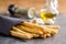 Italian grissini bread sticks seeds on kitchen table