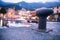 Italian harbour scene on the evening: cute village in the blurry background