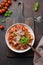 Italian homemade pasta fettuccine with meatballs, cheese, tomatoes, basil. View from above