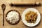 Italian ingredients homemade. Raw pasta, flour, rolling pin, wooden spoon on rustic surface