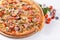 Italian kitchen and cooking concept. Hot tasty sliced with ham, sausage, jalapenos, mushrooms, tomato. Eat delivery