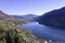 Italian lakes, travel, waters scenic postcard view across the lake and mountain clear day sky