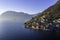 Italian lakes, travel, waters scenic postcard view across the lake and mountain clear day sky