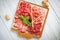 Italian meat antipasti set on wooden surfaces
