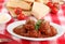 Italian meatballs in an oval dish.