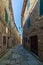 Italian medieval village details, historical stone alley, ancient marrow street, old city stone buildings architecture. Santa