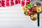 Italian and Mediterranean food ingredients on wooden background.Cherry tomatoes pasta, basil leaves and carafe with olive oil.