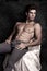 Italian model muscular man sitting. Shirtless portrait