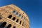 Italian monument to the Colosseum in the center of Rome in the afternoon.