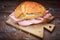 Italian mortadella sandwich on wooden floured table
