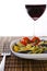 Italian multicolor pasta with wine glass