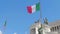 Italian national flags near white marble Altare della Patria monument in Rome