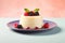 Italian Panna Cotta dessert with sweetened cream and berry fruits