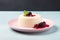 Italian Panna Cotta dessert with sweetened cream and berry fruits