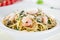 Italian pasta aglio olio with sea fruit