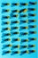 Italian pasta arranged in rows on a blue background