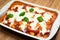 Italian pasta bake meal with melted mozzarella cheese topping on tasty tomato sauce, home made food