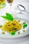 Italian pasta with basil pesto, late harvest wine