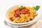 Italian pasta farfalle with meat and tomato sauce