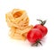Italian pasta fettuccine nest and cherry tomato